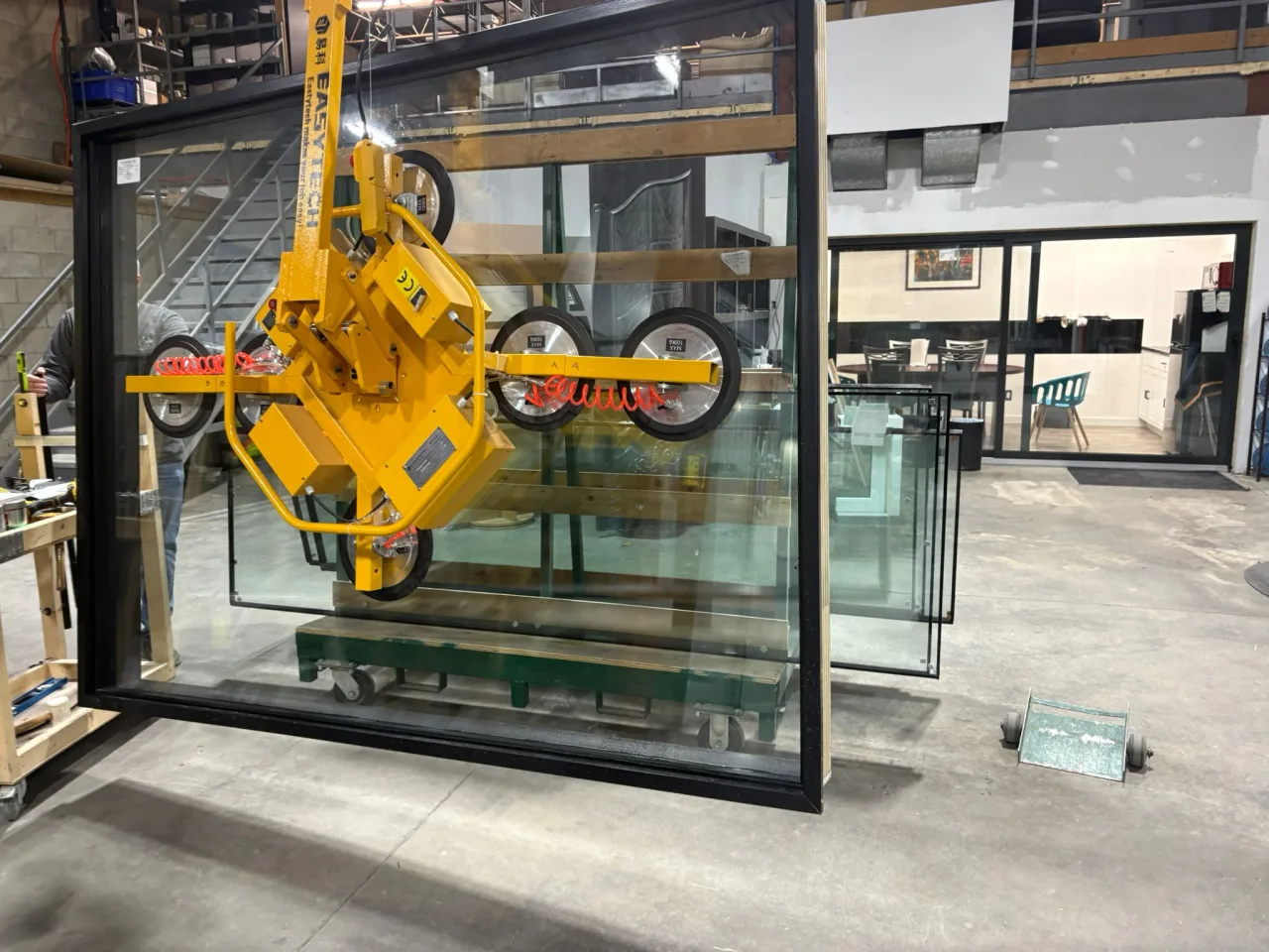 A vacuum frame holding a glass panel at an installation site. Application reference; check the specifications for your selected configuration.
